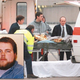 EMS workers load Dwayne Pafko (inset) into an ambulance after
he was hit by a big old honkin' bus.